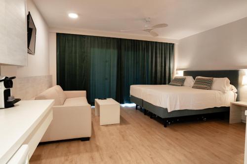 Ένα ή περισσότερα κρεβάτια σε δωμάτιο στο INN Mallorca Aparthotel