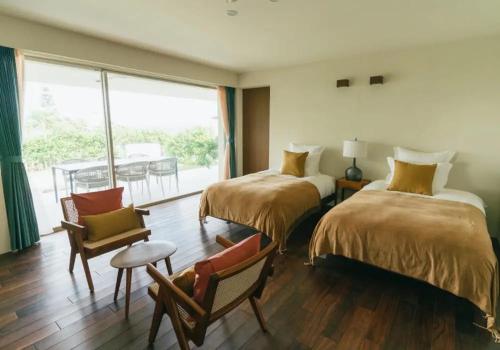 En eller flere senge i et værelse på プライベートヴィラ極海静邸 gokkai seitei