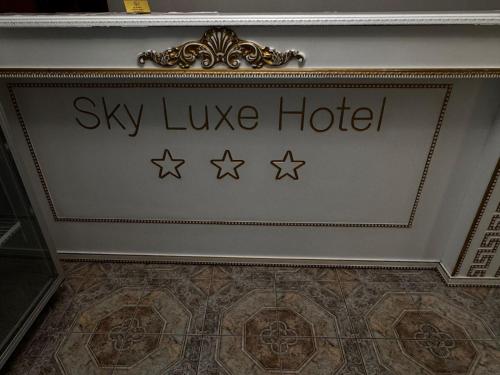 a sign that says sky live hotel on a wall at Sky luxe-hotel Astana in Astana