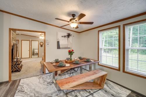 a living room with a table and a ceiling fan at 1 Mi to Geneva SP Family Home with Game Room and Yard in Geneva