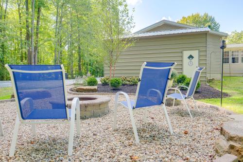 two blue and white chairs sitting in a yard at 1 Mi to Geneva SP Family Home with Game Room and Yard in Geneva