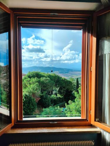 a window with a view of a forest at Ciliano 16 in Montepulciano
