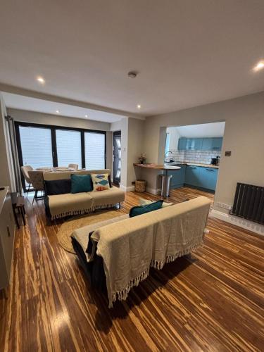 a large living room with a couch and a table at Small and Snug The Old Store in Broadstairs