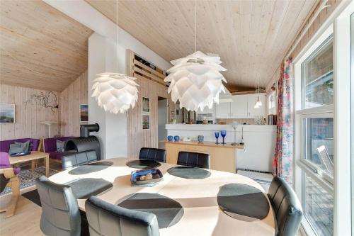 a dining room with a table and chairs at 30035-Malling-Pilelokken-16 in Malling
