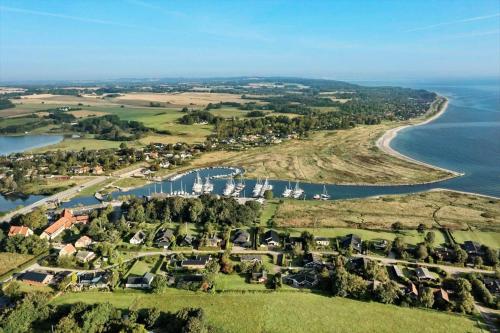 an aerial view of a village and a river at 30118-Odder-Pouli-Nielsensvej-27 in Beder