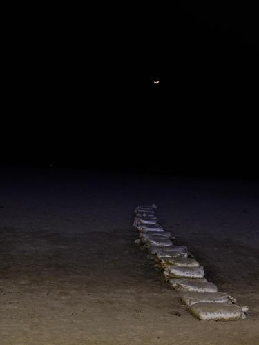 a row of stepping stones in the dark at Absolute paradise Kudle beach in Gokarna