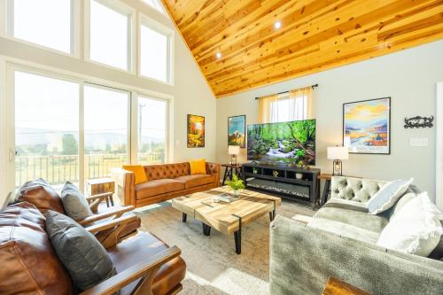 a living room with couches and a tv at Black Diamond By Masontyler in Davis