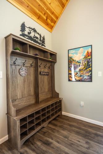 a room with a wooden book shelf in a room at Black Diamond By Masontyler in Davis