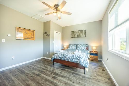 a bedroom with a bed and a ceiling fan at Black Diamond By Masontyler in Davis