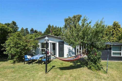 a hammock in front of a tiny house at 30038-Beder-Hogevaenget-15 in Beder