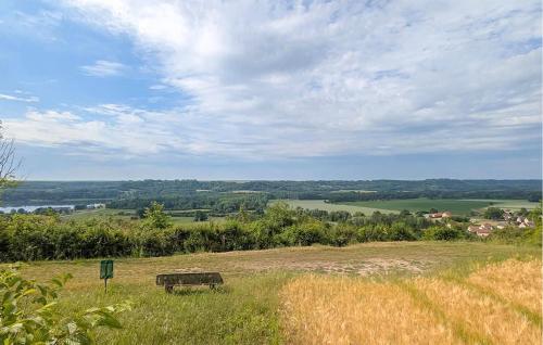 a bench sitting in the middle of a field at 2 Bedroom Stunning Home In Monthenault in Monthenault