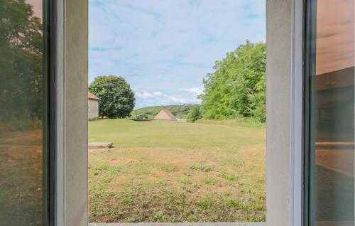 a view of a field from a window at 2 Bedroom Stunning Home In Monthenault in Monthenault