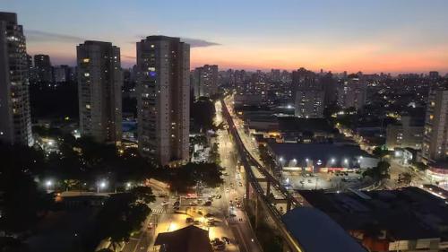 a view of a city at night with lights at Apto ao lado do metrô de SP in Sao Paulo