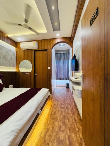 Postel nebo postele na pokoji v ubytování Hotel K Max