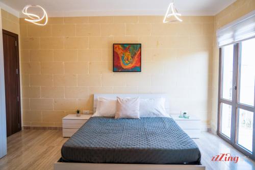 Ένα ή περισσότερα κρεβάτια σε δωμάτιο στο Family-Friendly Gozo Escape - Pool, Terrace & BBQ