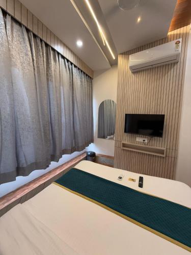 TV a/nebo společenská místnost v ubytování Hotel K Max