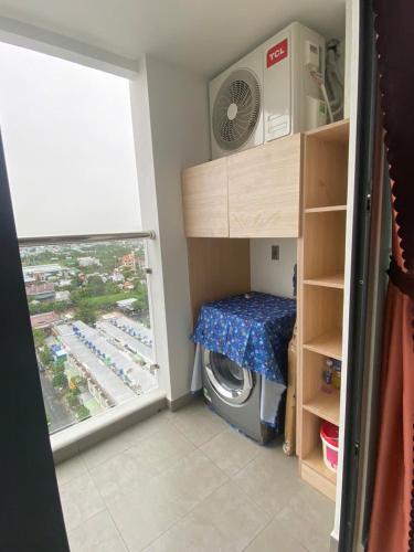 Ένα ή περισσότερα κρεβάτια σε δωμάτιο στο PAPAYA APARTMENT Căn hộ Sophia Center RACH GIA