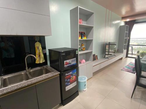 Η κουζίνα ή μικρή κουζίνα στο PAPAYA APARTMENT Căn hộ Sophia Center RACH GIA