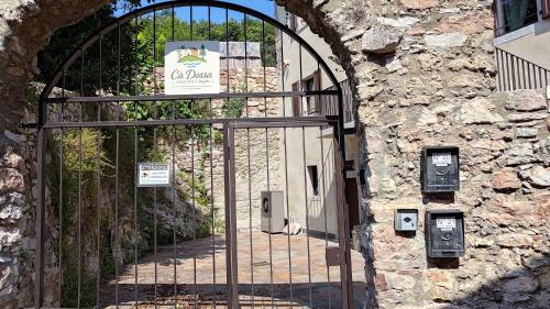 an entrance to a stone building with an iron gate at Cà Dossa in Padergnone