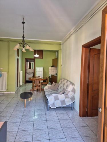 a living room with a couch and a table at Old Town Apartment in Kavala