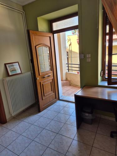 a room with a door and aoyer with a table at Old Town Apartment in Kavala