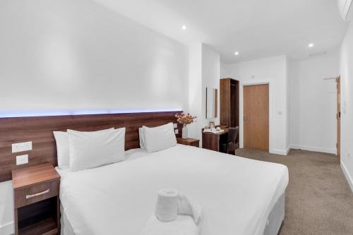 Signature Hotel Londonにあるベッド