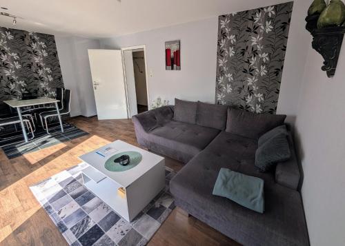 a living room with a couch and a table at Ferienwohnung Familie Perl in Immenhausen