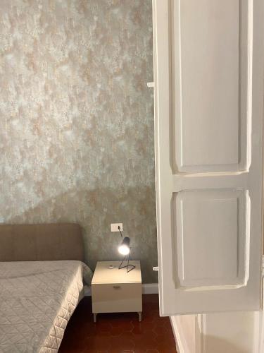 Postel nebo postele na pokoji v ubytování Alimena Retrò Rooms