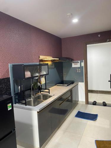 Η κουζίνα ή μικρή κουζίνα στο PAPAYA APARTMENT Căn hộ Sophia Center RACH GIA
