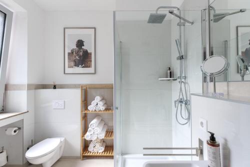 a bathroom with a shower and a toilet and a sink at Little Japan in Düsseldorf