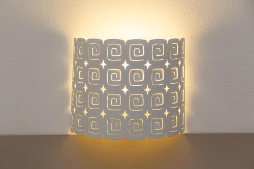 a light on a ceiling with a keyboard on it at Hotel Nettuno in Cala Gonone