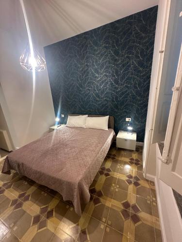 Postel nebo postele na pokoji v ubytování Alimena Retrò Rooms