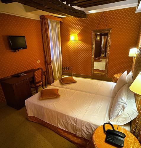 Postel nebo postele na pokoji v ubytování Hotel Corte Contarina