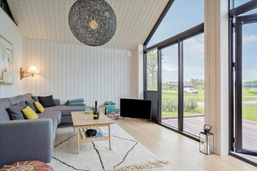 a living room with a couch and a tv at 30458-Odder-Strandvaenget-44 in Odder