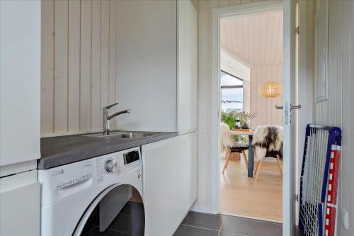 a kitchen with a washing machine and a sink at 30458-Odder-Strandvaenget-44 in Odder