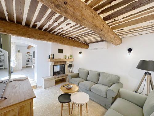 a living room with a couch and a table at les gites de la Fée in Cavaillon