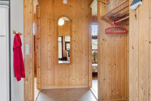a room with a wooden wall with a doorway at 30168-Odder-Pouli-Nielsensvej-3 in Beder