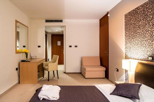 Tempat tidur dalam kamar di ZOO hotel