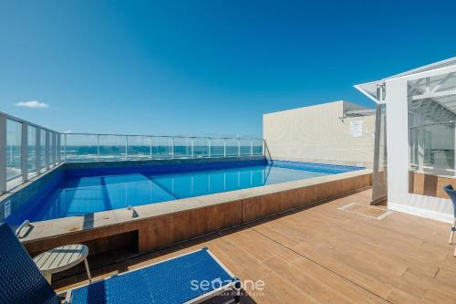 a swimming pool on the roof of a building at Condo. c/ Piscina e Academia a 70m da Praia - SMA in Salvador
