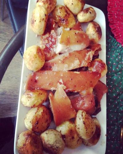 a plate of food with potatoes and meat on a table at Siboshvilis Guesthouse in Sagarejo