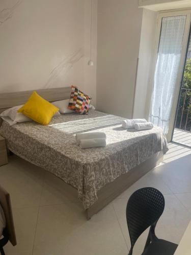 Un ou plusieurs lits dans un hébergement de l'établissement Tarantella apartment