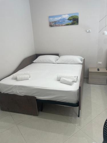 Un ou plusieurs lits dans un hébergement de l'établissement Tarantella apartment