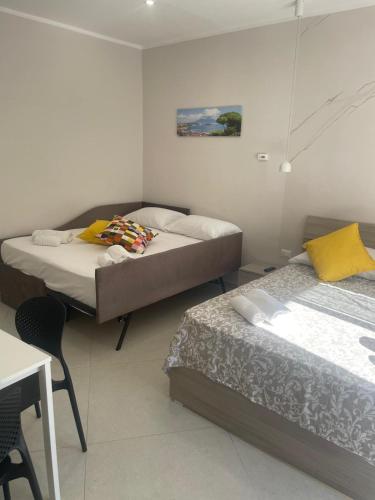 Un ou plusieurs lits dans un hébergement de l'établissement Tarantella apartment