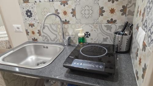 Cuisine ou kitchenette dans l'établissement Tarantella apartment