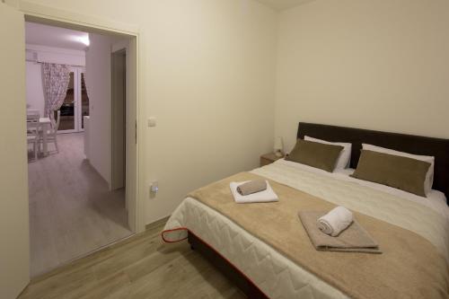Postel nebo postele na pokoji v ubytování Apartments Raskovic