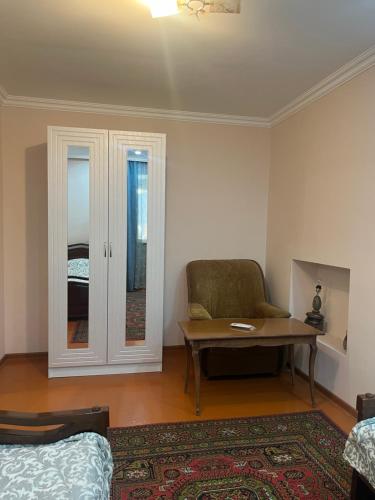 a living room with a couch and a table at ДАВТЯН ДОМ in Yerevan