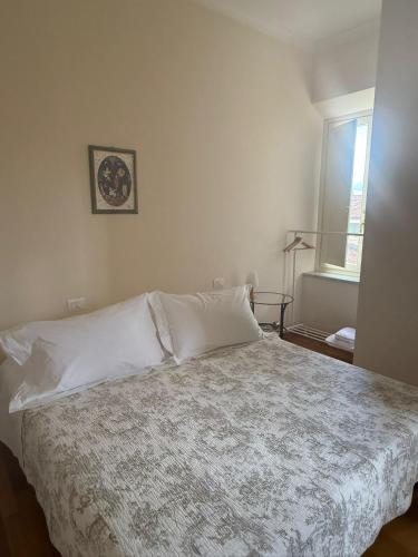 Ένα ή περισσότερα κρεβάτια σε δωμάτιο στο Palazzo Rocchi - Residenza D'Epoca