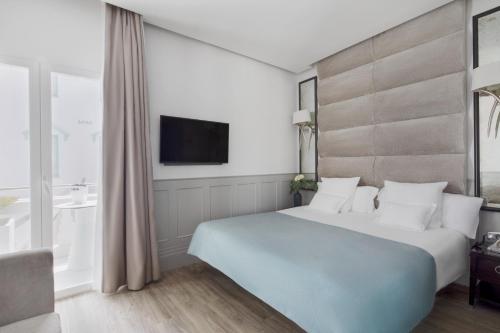 Hotel MiM Ibiza & Spa - Adults Onlyにあるベッド