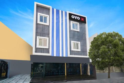 a building with an ovo sign on the side of it at Hotel O Skyline in Surūrnagar