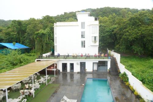 a view of a resort with a swimming pool at Baga Courtyard in Anjuna